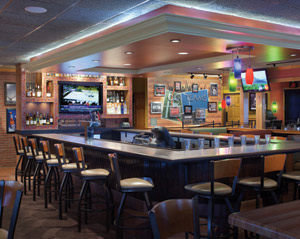 The new Applebee’s prototype design includes a sleeker, slightly larger bar area with strategically placed TV screens, varied seating styles and a dramatically lit back bar. The new Applebee’s prototype design includes a sleeker, slightly larger bar area with strategically placed TV screens, varied seating styles and a dramatically lit back bar.