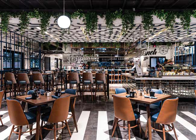 The view from the front of the restaurant showcases the Bloody Mary bar’s mirrored glass tiles. Images courtesy of Hash Kitchen