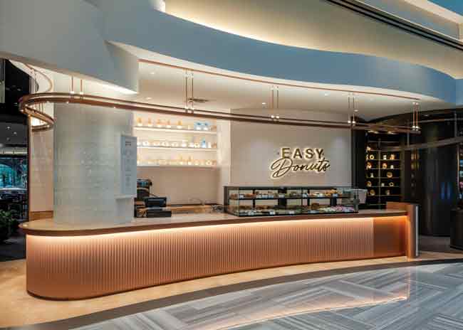 In true Vegas fashion, the team behind the Proper Eats food hall added a secret speakeasy that guests can only access at night through the doughnut stall. Image courtesy of Jeff Green