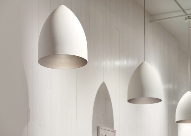 Design highlights include these egg-shaped lighting fixtures, which align with a breakfast concept.