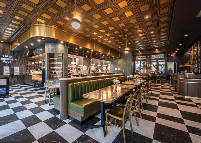 The center area offers diner-style booth and banquette seating, while a dedicated mobile-order pick-up tower keeps to-go traffic separate.