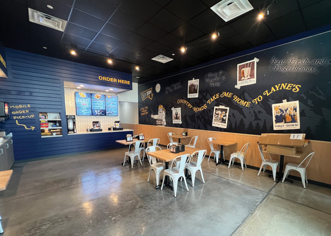 Layne’s uses sealed concrete floors and butcher block tables. This West Virginia location includes a spin on a line from a the John Denver song. 