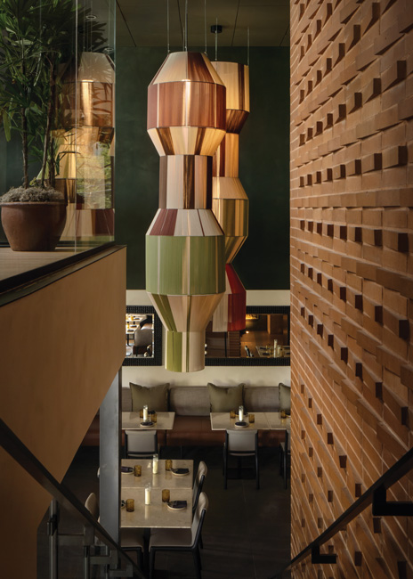 Nodding to the Yucatán region’s tradition of handcrafted arts, custom 18-foot woven pendants also lend a contemporary aesthetic to the space.