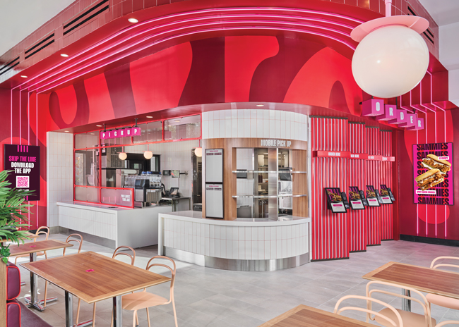The POS area features touch-screen ordering, neon lights, and plenty of pink and red.