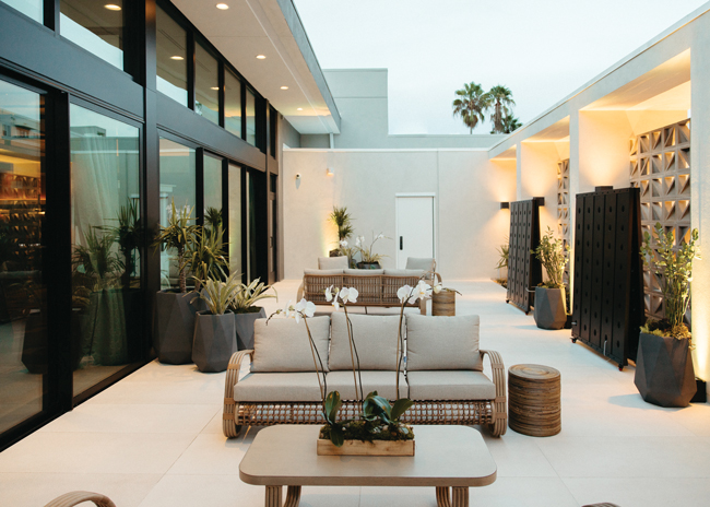 This outdoor space connects to a private dining area, creating a large venue for celebrations and events.