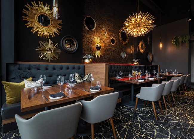 Abstract artwork and modern light fixtures make a bold statement at Cut 132. Images courtesy of Sam Brown