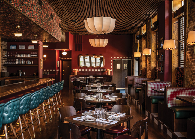 Starting from a base of original wood floors and exposed brick, the designers fashioned a fresh take on classic neighborhood Italian with an eclectic mix of vintage and modern elements.