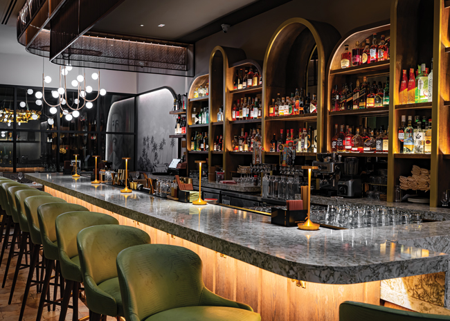 Arches throughout Indibar create continuity while the colors encompass Arizona and the Indian jungle. Image courtesy of Indibar